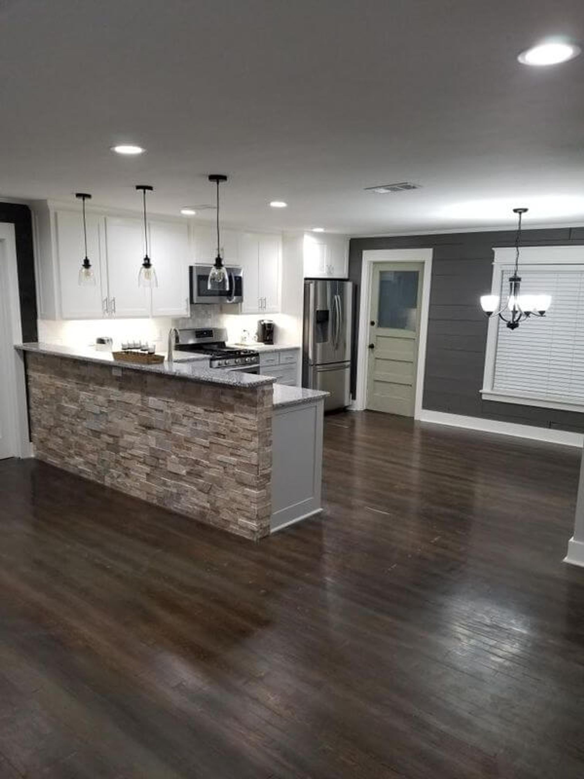 open kitchen with hardwood floors